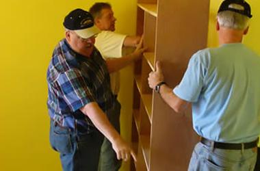 community_bob_michael_installing_shelves